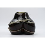 Artistic vase with a braided design