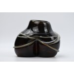 Artistic vase with a braided design
