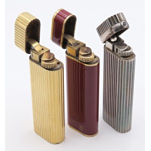 Lighters - CARTIER - Lotto di 3 accendini -corpi argentati, dorati ed u...