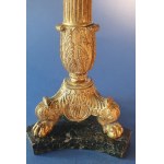 Pair of Empire candlesticks. Gilded bronze. First half of the 19th century. Slight chipping on the marble base.