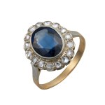 Gold ring with a synthetic sapphire and natural diamonds—certified