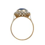 Gold ring with a synthetic sapphire and natural diamonds—certified