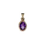 Gold pendant with a large natural amethyst and pearls