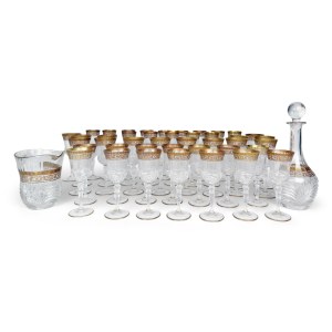 Crystal glassware set featuring an engraved and painted gilded band with leaf scrolls