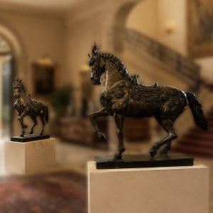 Pair of patinated bronze caparisoned horses