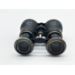 A vintage Le Sportsman binocular with a compass