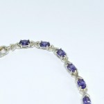Silver bracelet with purple stones