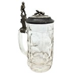 Faceted glass mug with a pewter lid featuring a bowling motif