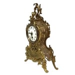 Fireplace set: A clock and two candlesticks in the Louis XV / Rococo style
