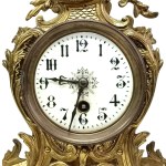Fireplace set: A clock and two candlesticks in the Louis XV / Rococo style