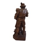 Wooden figurine of a Tyrolean couple with a console table