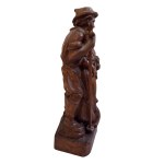 Wooden figurine of a Tyrolean couple with a console table