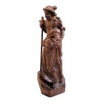 Wooden figurine of a Tyrolean couple with a console table