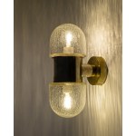 A double-sided wall sconce designed by Rolf Kruger for Neuhaus, Germany, in the 1970s.