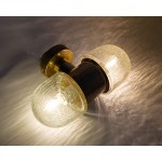 A double-sided wall sconce designed by Rolf Kruger for Neuhaus, Germany, in the 1970s.