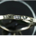 Ring with a floral motif, marked T.H. (175)