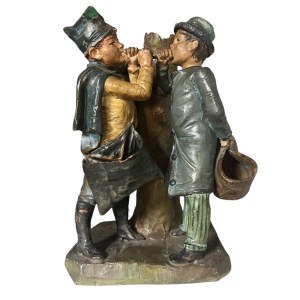 Polychrome ceramic sculpture depicting two young chimney sweeps, approximately 18 cm