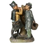 Polychrome ceramic sculpture depicting two young chimney sweeps, approximately 18 cm