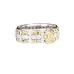 A wedding band with diamonds and yellow sapphires, contemporary