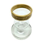 Vintage candlestick made of faceted glass with a gold rim