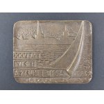 Plaque. 25 Years of MKS Szkuner. 1964–1989.