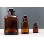 Set of three amber glass pharmacy bottles — second half of the 20th century