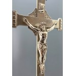An old nickel-plated crucifix with a figure of Jesus on an ornate base—France, first half of the 20th century