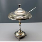 An eclectic silver-plated sugar bowl on a foot with an openwork pattern—first half of the 20th century