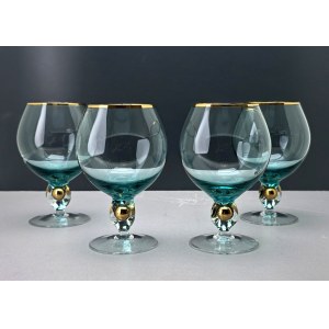 A set of four ZŁOTA ZUZANNA cognac glasses in turquoise blue