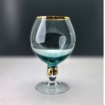 A set of four ZŁOTA ZUZANNA cognac glasses in turquoise blue