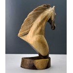 A wooden sculpture of a horse