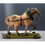 An old wooden toy horse on a cart - first half of the 20th century