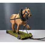 An old wooden toy horse on a cart - first half of the 20th century