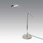 Mid-Century Modern-style floor lamp with an adjustable metal arm, finished in chrome