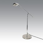 Mid-Century Modern-style floor lamp with an adjustable metal arm, finished in chrome