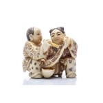 NETSUKE OF BOYS PRACTICING CALLIGRAPHY | JAPAN