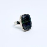 Silver ring with a black Solid opal