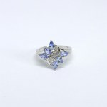 Silver ring with natural tanzanites and white sapphires