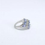 Silver ring with natural tanzanites and white sapphires