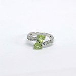 Silver ring with natural peridots and white sapphires