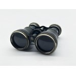A vintage Le Sportsman binocular with a compass