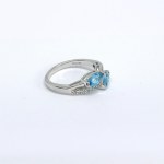 Silver ring with natural white and blue topaz stones