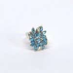 Silver ring with natural blue topazes