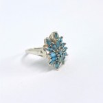 Silver ring with natural blue topazes