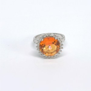 Silver ring with a natural Padparadscha topaz and white topazes