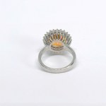 Silver ring with a natural Padparadscha topaz and white topazes