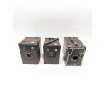Three Kodak Brownie cameras—the Popular Brownie, the Six-20 Brownie Junior, and the Portrait Brownie