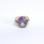Silver ring with a large mystic topaz