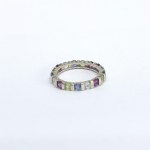 Silver eternity ring with natural peridots, iolites, garnets, and topazes