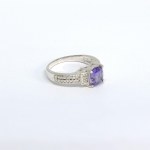 Silver ring with natural amethyst and white sapphires